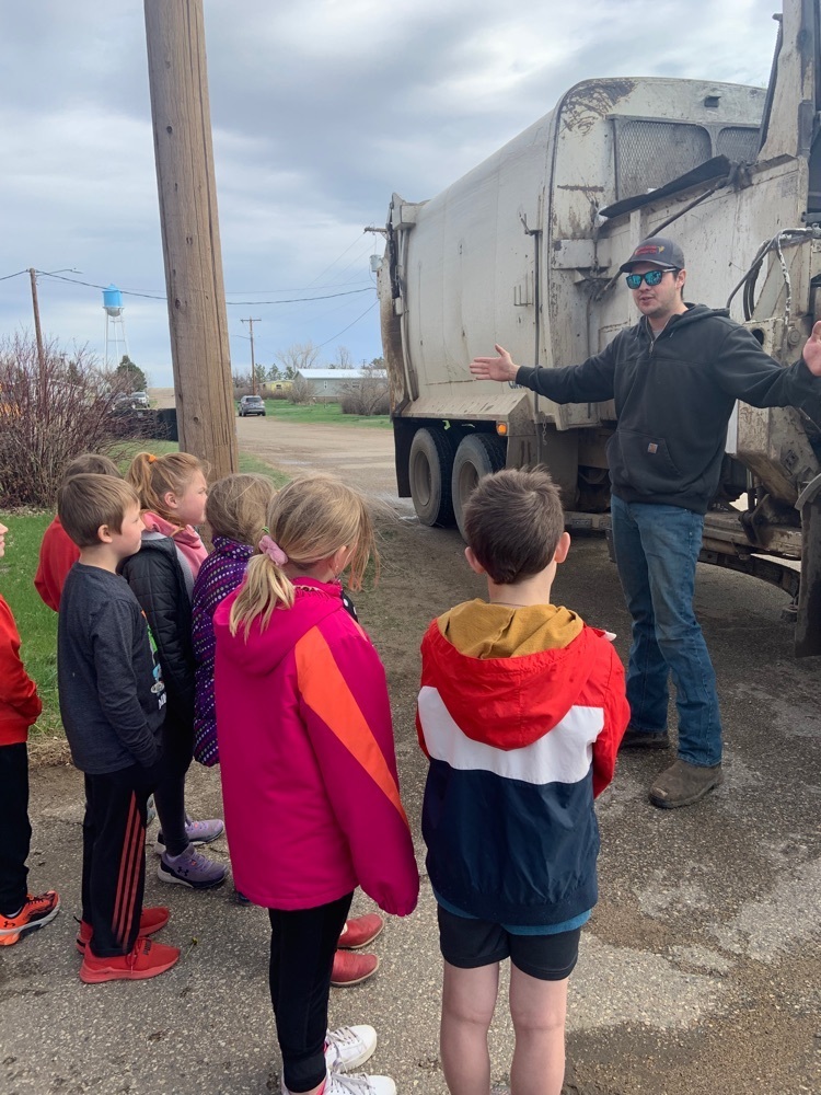 Russell showing the kids how his truck works 